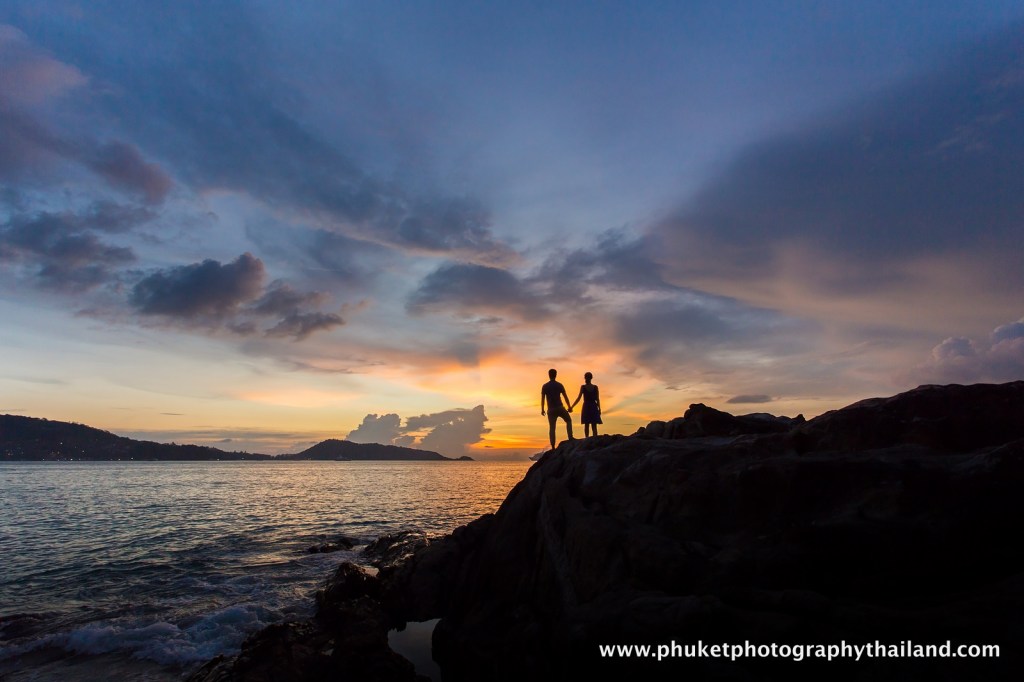 couple at kalim beach , phuket , thailand