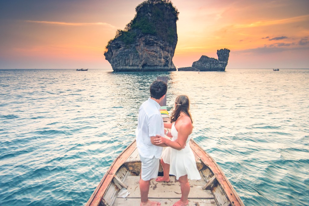 Honeymoon couple photoshoot on long tail boat at Phi Phi Krabi Thailand